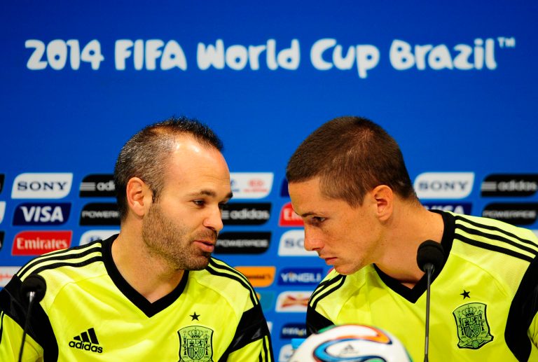 Spain's Andres Iniesta, left, and Fernando Torres talk during an official training session the day before the group B World Cup soccer match between Spain and Chile at the Maracana stadium in Rio de Janeiro, Brazil, Tuesday, June 17, 2014. Spain will play in group B of the Brazil 2014 World Cup. (AP Photo/Manu Fernandez)