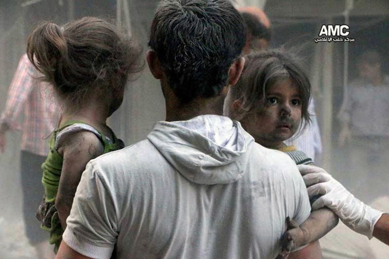 This Wednesday, July 9, 2014 photo, provided by the anti-government activist group Aleppo Media Center (AMC), which has been authenticated based on its contents and other AP reporting, shows a Syrian man helping children out of a damaged building following a Syrian government airstrike in the Shaar neighborhood of Aleppo, Syria. (AP Photo/Aleppo Media Center AMC)
