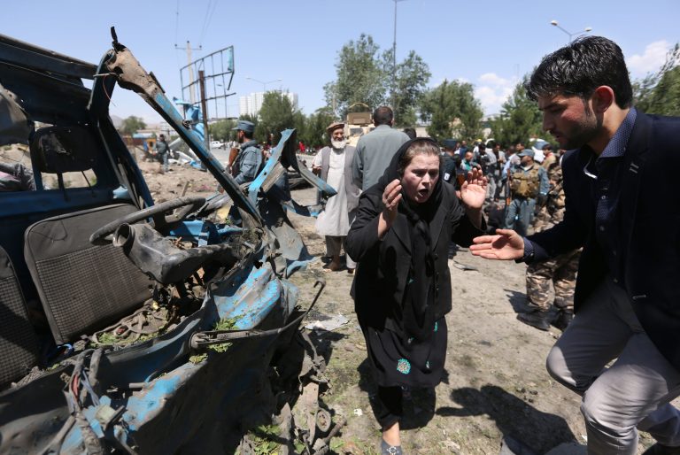 In this Tuesday, June 30, 2015 file photo, an Afghan woman cries out at the site of a suicide attack on a NATO convoy in Kabul, Afghanistan. (AP Photo/Rahmat Gul, File)