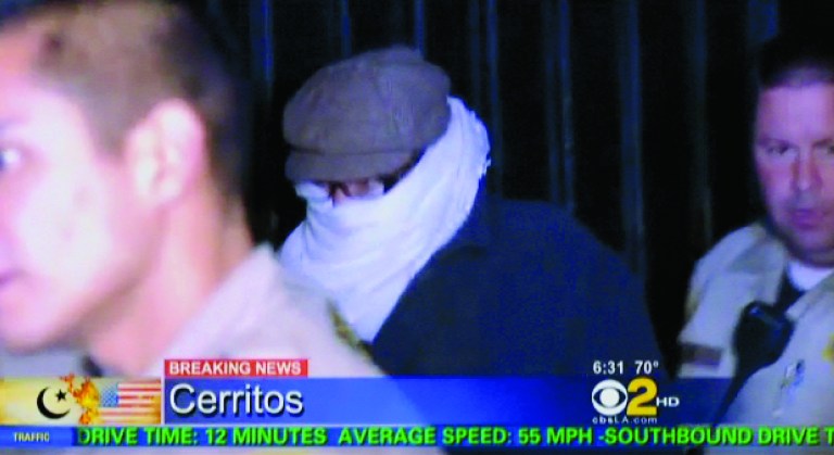 FILE - In this Sept. 15, 2012 file image from video provided by CBS2-KCAL9, Nakoula Basseley Nakoula, the man behind a crudely produced anti-Islamic video that has inflamed parts of the Middle East, is escorted by Los Angeles County sheriff's deputies from his home in Cerritos, Calif. Nakoula, 55, was arrested Thursday for violating terms of his probation, authorities said. (AP Photo/CBS2-KCAL9, File) MANDATORY CREDIT CBS-KCAL9, LOS ANGELES OUT, LOS ANGELES TV OUT