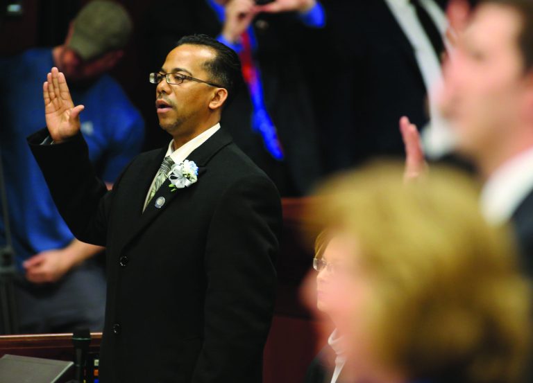 Embattled Nevada Assemblyman Steven Brooks, D-North Las Vegas, takes the oath of office during the opening day of the 77th Legislative Session in Carson City, Nev. on Monday, Feb. 4, 2013. Brooks was arrested Jan. 19 and accused of threatening incoming Democratic Speaker Marilyn Kirkpatrick. (AP Photo/Cathleen Allison)