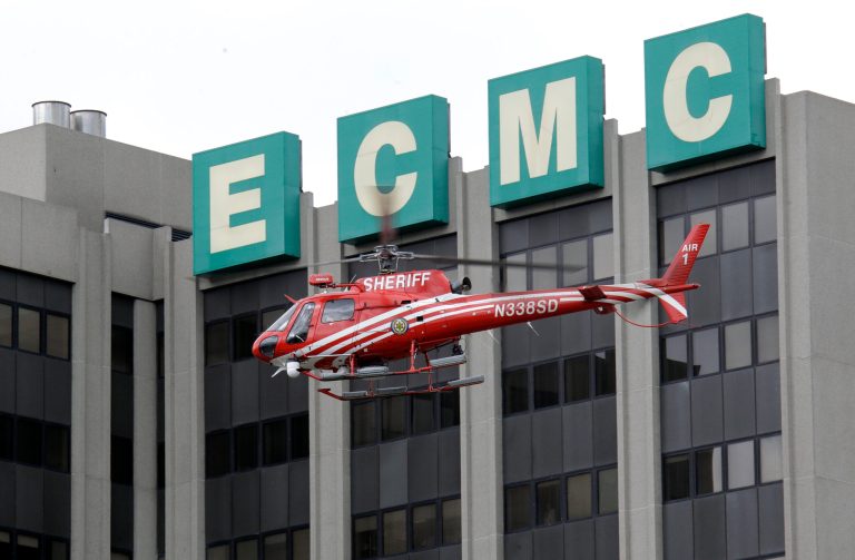   An Erie County Sheriff's helicopter searches at the scene of a shooting at Erie Count Medical Center in Buffalo, N.Y., Wednesday, June 13, 2012. A police official confirms that a woman was killed Wednesday morning on the grounds of the Erie County Medical Center, which he describes as being in 