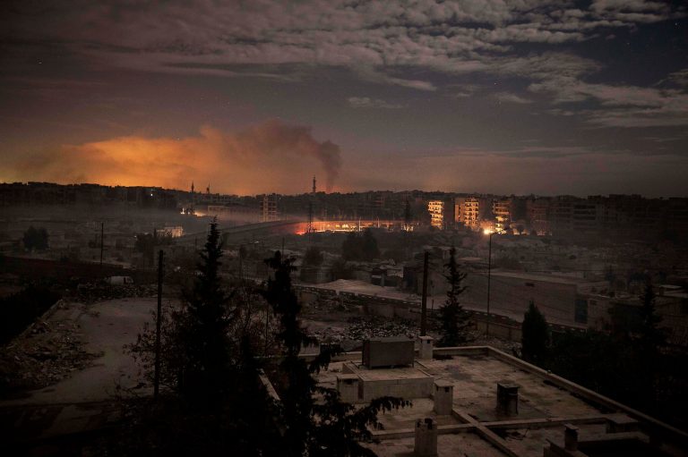  In this Saturday, Dec. 1, 2012 photo, smoke rises from buildings due to heavy fighting between Free Syrian Army fighters and government forces in Aleppo, Syria. (AP Photo/Narciso Contreras)  