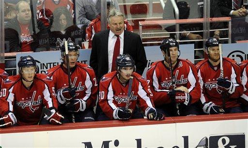 Washington Capitals head coach Dale Hunter, top center, seen in the bench area during the first period of an NHL hockey game against the St. Louis Blues, Tuesday, Nov. 29, 2011, in Washington.