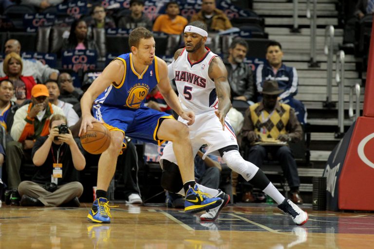   Golden State Warriors power forward David Lee (10) drives to the basket as Atlanta Hawks small forward Josh Smith (5) defends in the first half of an NBA basketball game on Saturday, Dec. 15, 2012, in Atlanta. (AP Photo/Todd Kirkland)  