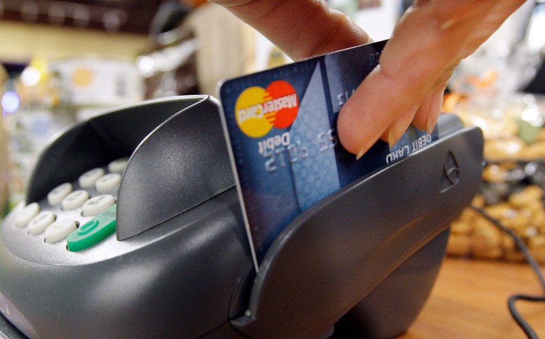 Debit reform deals with the way banks process the transaction when you swipe their debit card to pay for something. (AP Photo/Elaine Thompson, file)