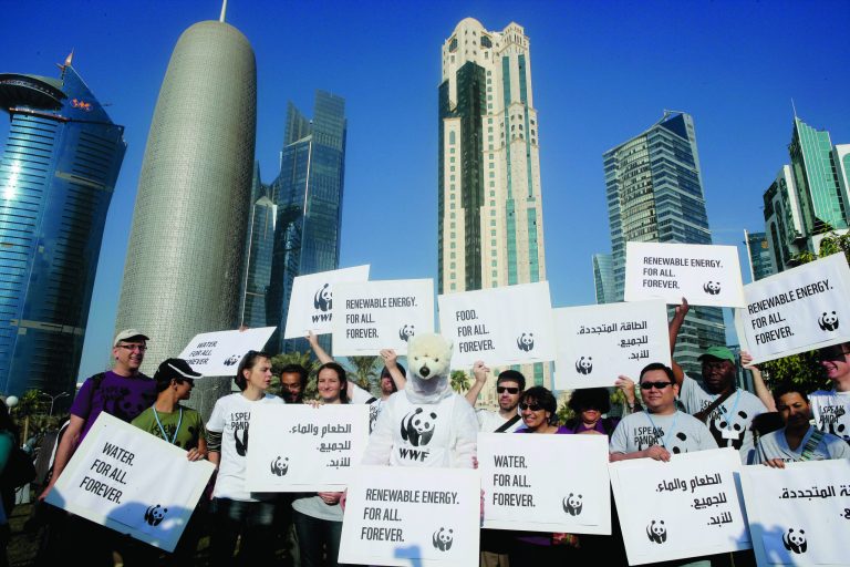 Local and international activists march to demand urgent action to address climate change at the U.N. climate talks in Doha, Qatar, Saturday , Dec. 1, 2012. (AP Photo/Osama Faisal)