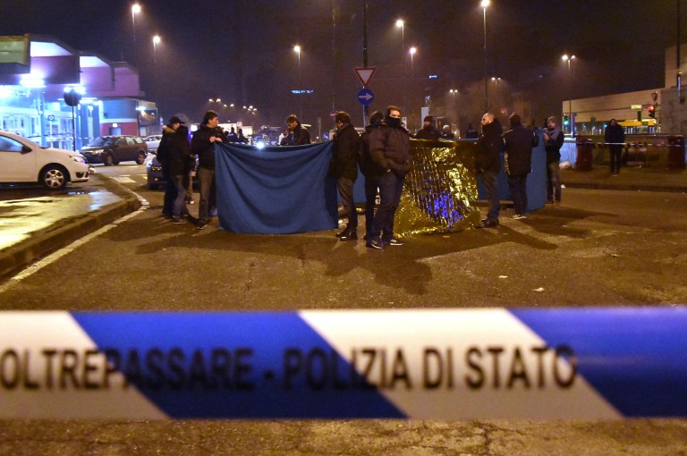 Italian Police cordon off an area after a shootout between police and a man near a train station in Milan's Sesto San Giovanni neighborhood, Italy, early Friday, Dec. 23, 2016. Italy's interior minister Marco Minniti says the man killed in an early-hours shootout in Milan is 