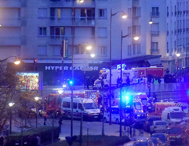 French firemen and emergency doctors enter a kosher deli during a hostage situation at Port de Vincennes on Jan. 9, 2015 in Paris. (Photo by Antoine Antoniol/Getty images)