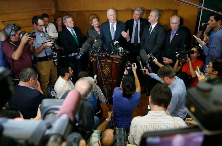 U.S. Senator Patrick Leahy from Vermont, center, speaks to the press as fellow lawmakers stand with him in Havana Cuba, Monday, Jan. 19, 2015. U.S. lawmakers standing with Leahy are, from left, Senator Richard Joseph Durbin from Illinois, Senator Deborah Ann Stabenow of Michigan, Senator Sheldon Whitehouse of Rhode Island, Congressman Chris Van Hollen of Maryland, and Congressman Peter Welch of Vermont. (AP Photo/Desmond Boylan)