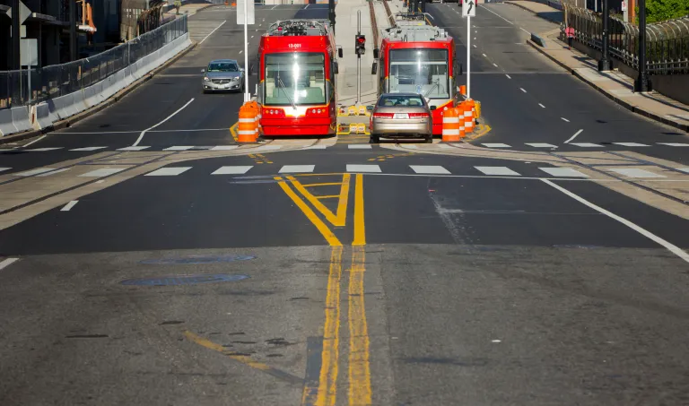 A pair of new streetcars sit parked at the bottom of Hopscotch Bridge near Union Station, Sunday, April 27, 2014 in Washington. (AP Photo/Pablo Martinez Monsivais)