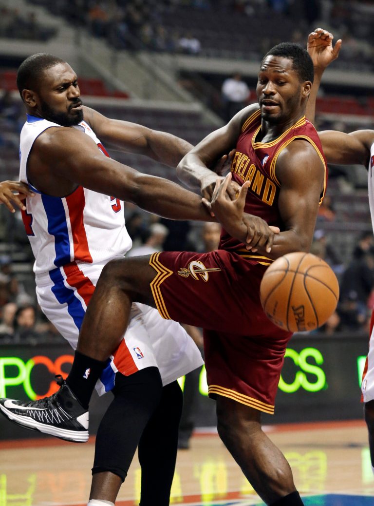   Detroit Pistons forward Jason Maxiell (54) and Cleveland Cavaliers guard Jeremy Pargo (8) vie for the ball in the first half of an NBA basketball game in Auburn Hills, Monday, Dec. 3, 2012. (AP Photo/Paul Sancya)  