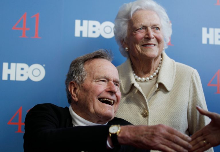   FILE - In a Tuesday, June 12, 2012 file photo, former President George H.W. Bush, and his wife, former first lady Barbara Bush, arrive for the premiere of HBO's new documentary on his life near the family compound in Kennebunkport, Maine. The 41st president will spend Christmas in a Houston hospital after developing a fever and weakness following a monthlong, bronchitis-like cough. Bushâs spokesman Jim McGrath said Monday, Dec. 24, 2012, that doctors remain âcautiously optimisticâ that he will recover, but they want to keep him in the hospital. (AP Photo/Charles Krupa, File)  