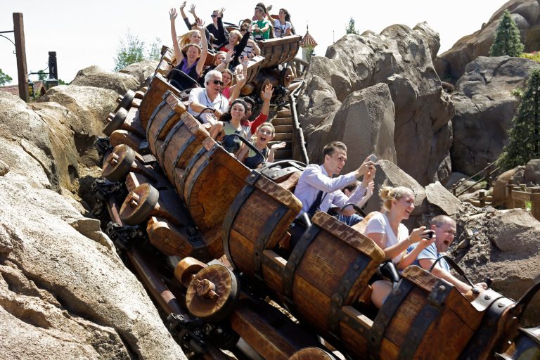 This May 16, 2014 photo shows Disney castmembers testing the new Seven Dwarfs Mine Train roller coaster in the Magic Kingdom at Walt Disney World, in Lake Buena Vista, Fla. The ride will be open to park guests on May 28. (AP Photo/John Raoux)