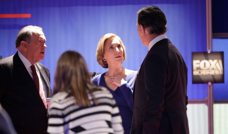 At the last GOP debate in North Charleston, S.C., there were three candidates at the undercard event: Mike Huckabee, Rick Santorum and Carly Fiorina. (AP Photo/Chuck Burton)