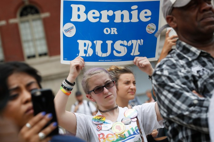 While Donald Trump attempts to court Sanders supporters in 140-character form, the RNC has begun scouring through its expansive voter database to identify Americans who may be vulnerable to persuasion. (AP Photo/John Minchillo)