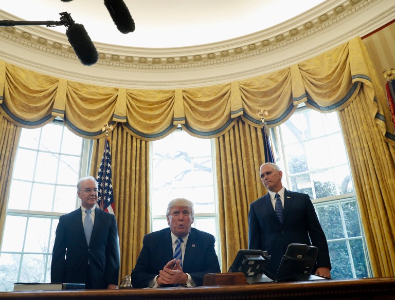President Donald Trump, flanked by Health and Human Services Secretary Tom Price, left, and Vice President Mike Pence, meets with members of the media regarding the health care overhaul bill, Friday, March 24, 2017, in the Oval Office of the White House in Washington. (AP Photo/Pablo Martinez Monsivais)