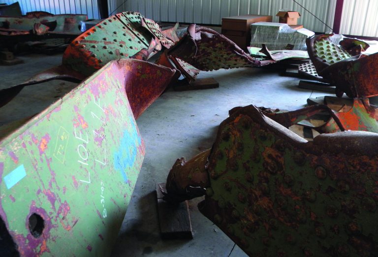 Rusting beams from the Interstate 35W bridge that collapsed Aug. 1, 2007 in Minneapolis are seen on the floor of a Minnesota transportation department garage in Oakdale, Minn. on Tuesday, July 31, 2012. Wednesday, Aug. 1, marks the fifth anniversary of the collapse. To remember the bridge collapse, state historians preserved items they thought would vividly convey the chaotic scene that August evening in 2007. Five years later, most items collected from the rush-hour disaster that killed 13 and injured scores more remain mostly tucked away, held back partly by concern that emotions may be too raw for a display. (AP Photo/Brian Bakst)