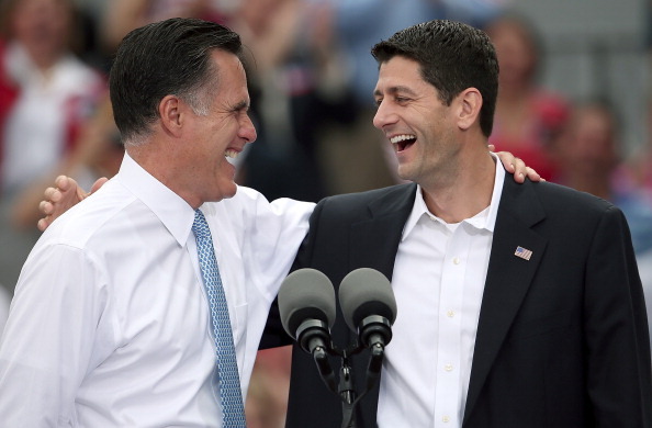 Republican presidential candidate Mitt Romney (L) jokes with Rep. Paul Ryan (R-WI) (R) after announcing him as the 
