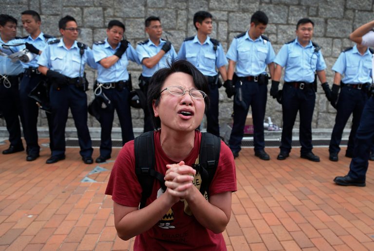 A student protester gets emotional while pleading for a peaceful resolution, Thursday, Oct. 2, 2014 in Hong Kong. The student leaders of the protests are warning that if the territory's top official doesn't resign by tomorrow, they will step up their actions -- including occupying several important government buildings. They'd be risking another round of confrontations with police, who are unlikely to let government buildings be stormed. (AP Photo/Wong Maye-E)