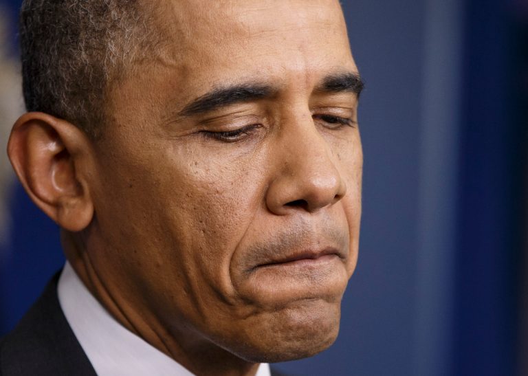 President Barack Obama pauses as he talks to reporters about the situation in Ukraine at the White House in Washington, Thursday, April 17, 2014. Obama also conveyed skepticism about Russian promises to de-escalate a volatile situation in Ukraine, and said the United States and its allies are ready to impose fresh sanctions if Moscow doesn't make good on its commitments. (AP Photo/J. Scott Applewhite)