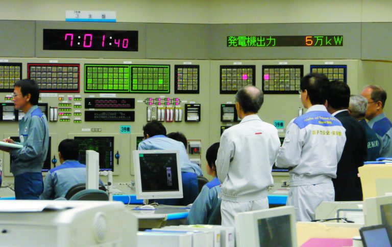 Technicians monitor at central control room of Ohi nuclear power plant in Ohi town, Fukui prefecture, western Japan after the No. 3 reactor began generating electricity in the first restart since last year's tsunami led to a nationwide nuclear power plant shutdown Thursday, July 5, 2012. (AP Photo/Kyodo News) JAPAN OUT, MANDATORY CREDIT, NO LICENSING IN CHINA, HONG KONG, JAPAN, SOUTH KOREA AND FRANCE