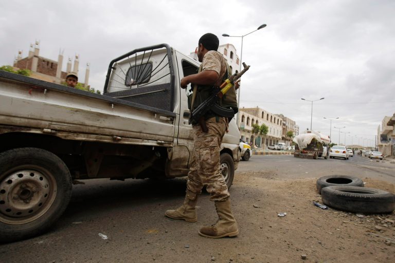 A Yemeni soldier checks a vehicle at a checkpoint in a street in Sanaa, Yemen, Monday, May 12, 2014. A suspected U.S. drone strike in southern Yemen killed seveal al-Qaida militants on Monday, military and security officials said. (AP Photo/Hani Mohammed)