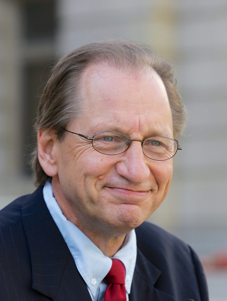 In this Sept. 23, 2013 photo, Democratic gubernatorial candidate Chuck Hassebrook smiles in Omaha, Neb. Now that his only opponent has bowed out of the Democratic race for governor, Hassebrook is promising a legislative agenda intended to draw support from both parties. The former University of Nebraska regent says he would focus on education funding, job-training programs and wind energy if he wins the uphill race in 2014. (AP Photo/Nati Harnik)