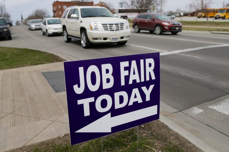 A sign points to a job fair on the campus of Kaplan University in Lincoln, Neb. (AP/Nati Harnik)