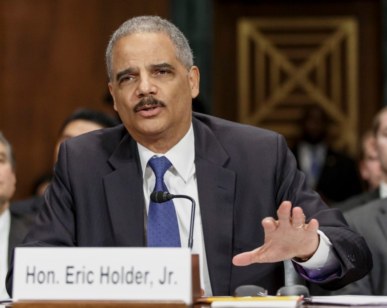 FILE - In this Jan. 29, 2014, file photo, Attorney General Eric Holder testifies on Capitol Hill in Washington. The Justice Department announced Feb. 21, 2014, it is revising its rules for obtaining records from the news media in leak investigations, promising that in most instances the government will notify news organizations beforehand of its intention to do so. The revised procedures are designed to give news organizations an opportunity to challenge any subpoenas or search warrants in federal court.  (AP Photo/J. Scott Applewhite, File)