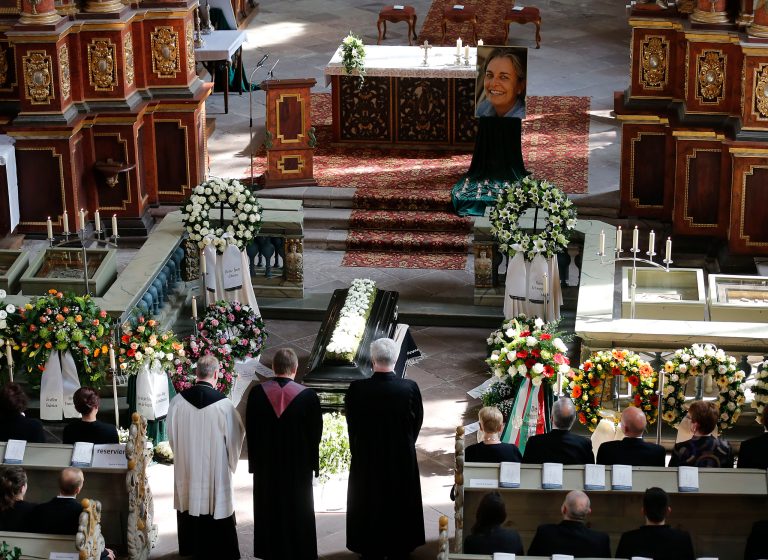 A photograph of Associated Press photojournalist Anja Niedringhaus is displayed inside Corvey Abbey during her funeral in Hoexter, Germany, Saturday, April 12, 2014. Niedringhaus was killed by an Afghan policeman in an attack on April 4, 2014 in Afghanistan. (AP Photo/Frank Augstein, pool)