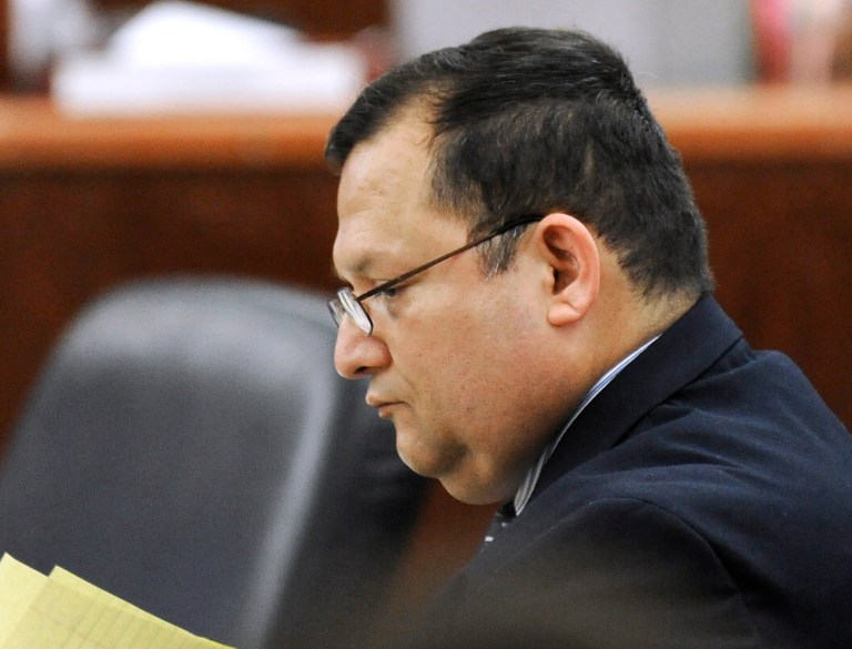   Raul Rodriguez sits in a Houston courtroom Monday, June 11, 2012. Rodriguez is charged with murder in a triple shooting in 2010 that left one man dead and two others injured during a dispute over the neighbor's loud party. The retired Houston-area firefighter told a police dispatcher by phone that he feared for his life and was 