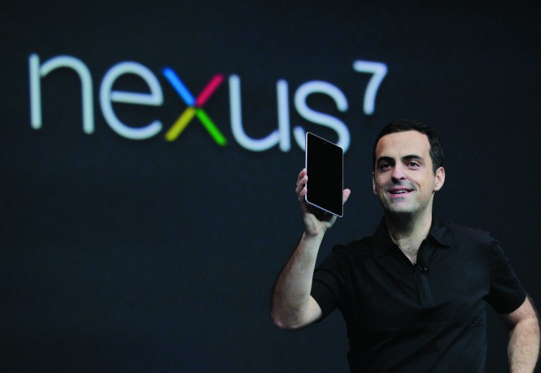 Hugo Barra, Director of Google Product Management, holds up the new Google Nexus7 tablet at the Google I/O conference in San Francisco, Wednesday, June 27, 2012. (AP Photo/Paul Sakuma)
