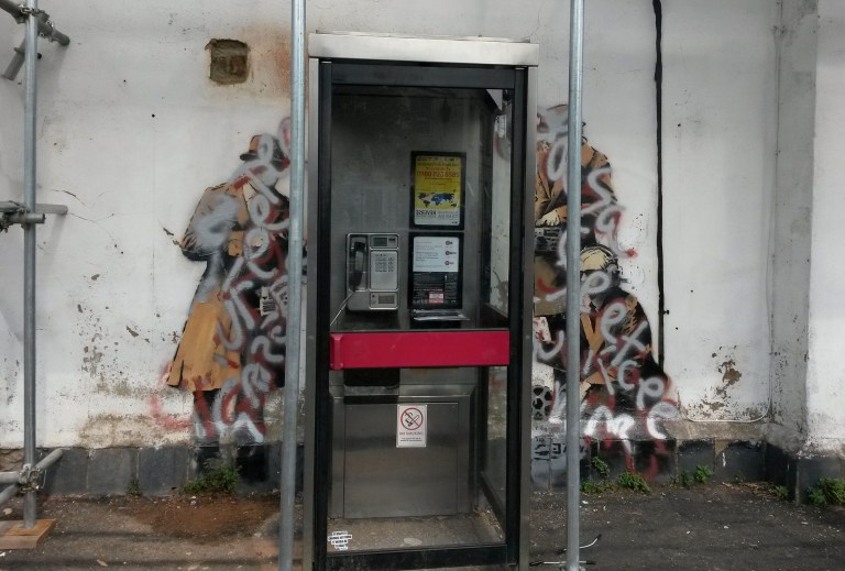 Banksy’s ‘Spy Booth’ artwork defaced