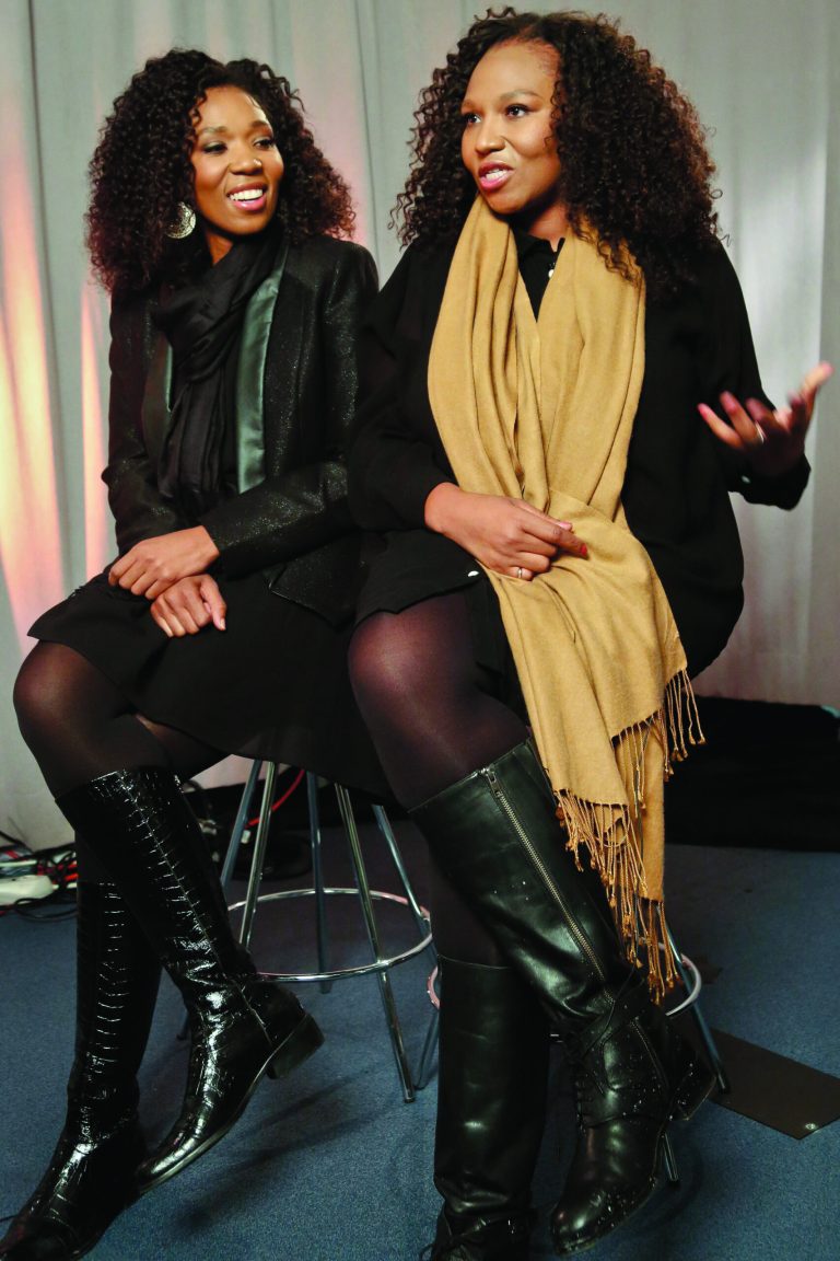 In this Wednesday, Feb. 6, 2013 photo, Swati Dlamini, left, and Zaziwe Dlamini-Manaway, granddaughters of Nelson and Winnie Mandela, speak during an interview in New York. The sisters are stars of the new reality show 