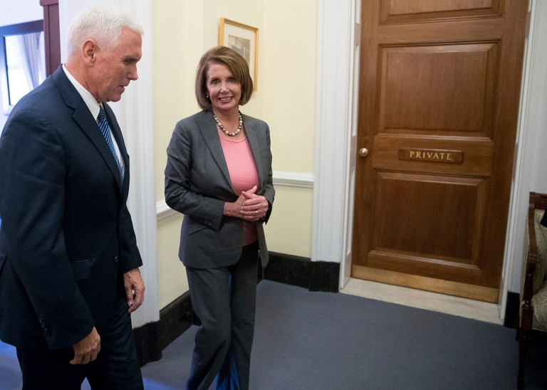 Vice President-elect Mike Pence and House Minority Leader Nancy Pelosi of Calif. leave a private meeting on Capitol Hill in Washington, Thursday, Nov. 17, 2016. (AP Photo/Andrew Harnik)