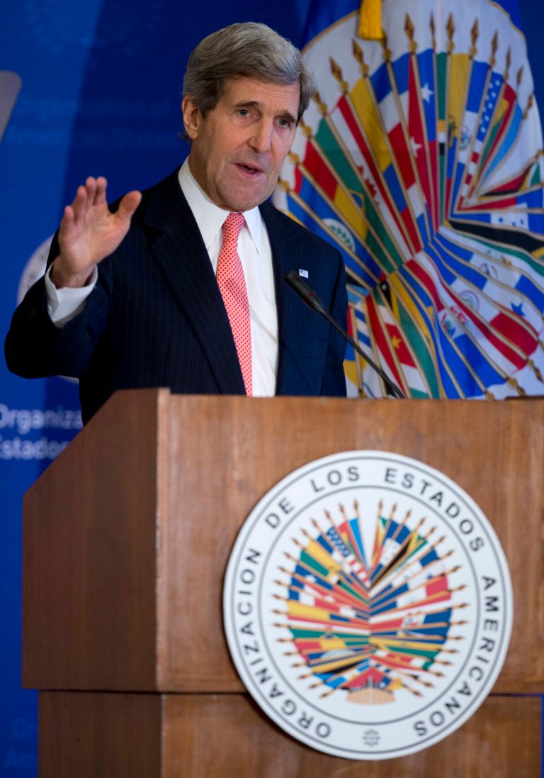 Secretary of State John Kerry gestures as he speaks at the Organization of American States (OAS) in Washington, Monday, Nov. 18, 2013, during and event co-hosted by the OAS and Inter-American Dialogue focusing on U.S. policy of partnership and engagement with the Western Hemisphere. (AP Photo/Carolyn Kaster)
