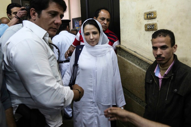 Aya Hijazi, center, a dual U.S.-Egyptian citizen, is acquitted by an Egyptian court after nearly three years of detention over accusations related to running a foundation dedicated to helping street children, in Cairo, Egypt. (AP Photo/Mohamed el Raai, File)