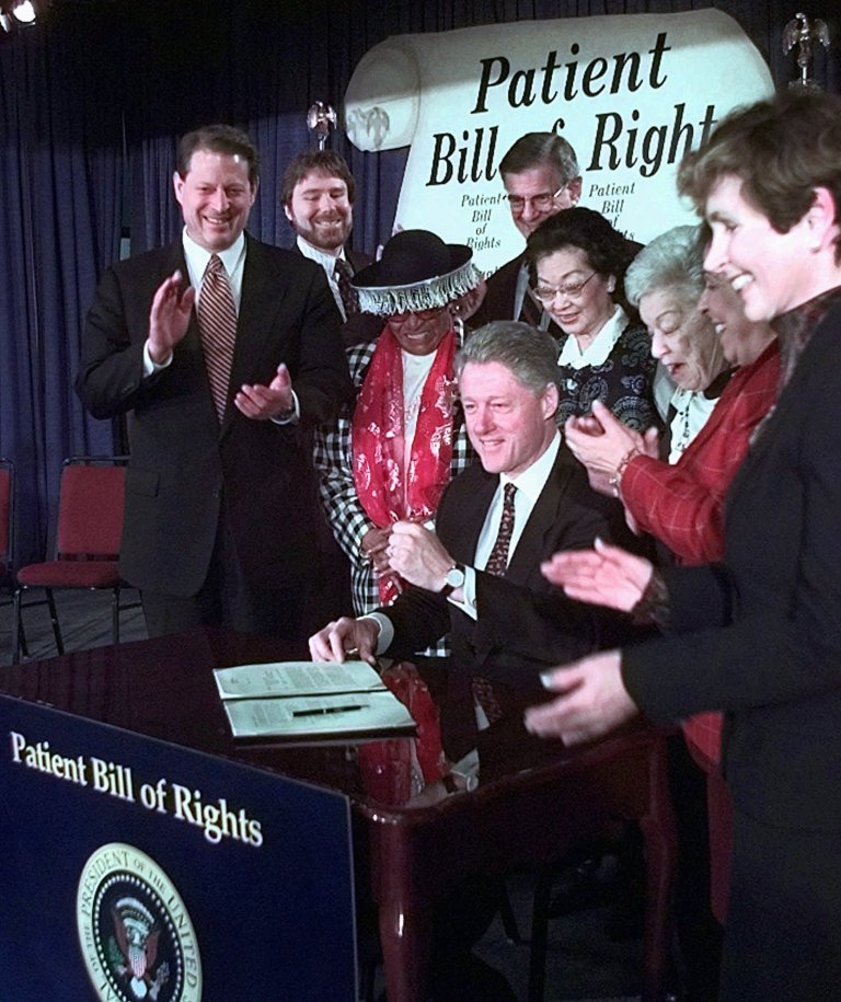 Chris Jennings, assistant to the president for health care, second from left, left the Clinton White House and started a lobbying firm. This week, the White House will announce that Jennings is coming on board as âhealth policy coordinator and strategist.â (Ruth Fremson/AP)