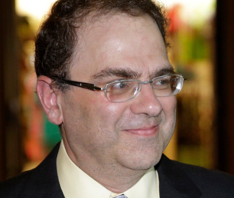 Narayana Kocherlakota, president and chief executive officer of the Federal Reserve Bank of Minneapolis, arrives for a dinner during the Jackson Hole Economic Policy Symposium at the Jackson Lake Lodge in Grand Teton National Park near Jackson, Wyo. Thursday, Aug. 21, 2014. (AP Photo/John Locher)