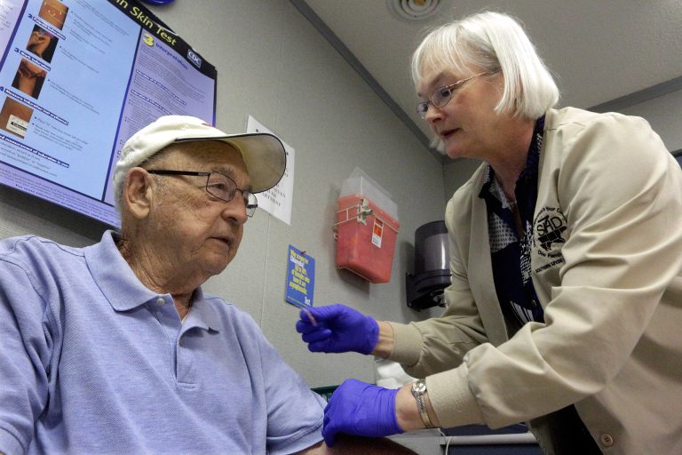 The flu hasn't hit as hard this season as the last three years, health officials say. (AP Photo/Seth Perlman)