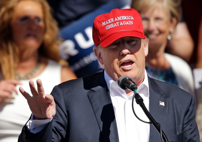 According to a new survey, a combined 49 percent of Americans would be somewhat or much less likely to cast their ballot for a candidate who has endorsed Donald Trump or embraced his agenda. (AP Photo/Elaine Thompson, File)