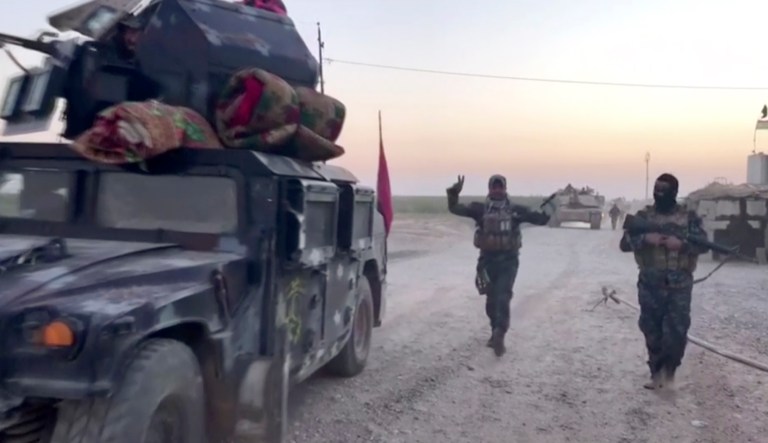 Iraqi state media say federal troops have entered disputed territories occupied by the nation's Kurds. The move comes three years after Kurdish militias seized the areas outside their autonomous region to defend against an advance by the Islamic State extremist group. (APTN via AP)