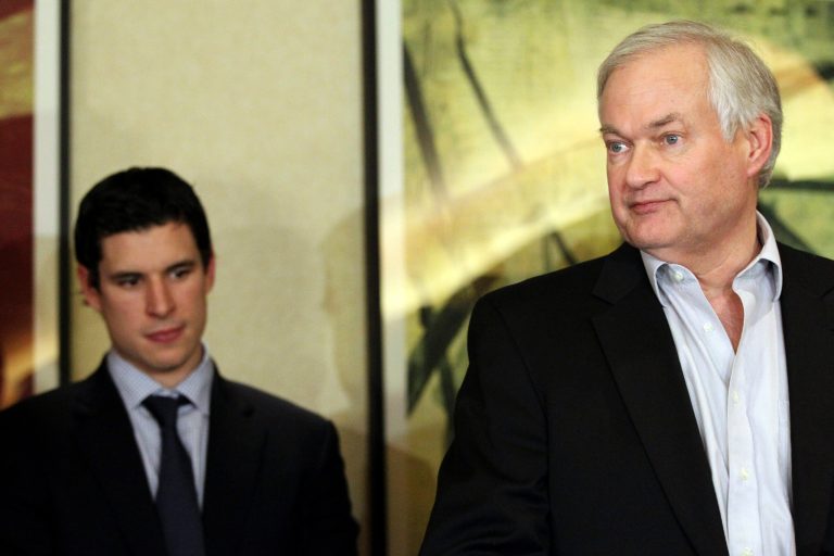   Pittsburgh Penguins' Sidney Crosby, left, listens as Don Fehr, executive director for the National Hockey League Players Associations, speaks to reporters on Thursday, Dec. 6, 2012, in New York. Talks in the NHL labor fight broke down after just one hour on Thursday night, and it is not known when the league and the players' association would get back together. (AP Photo/Mary Altaffer)  