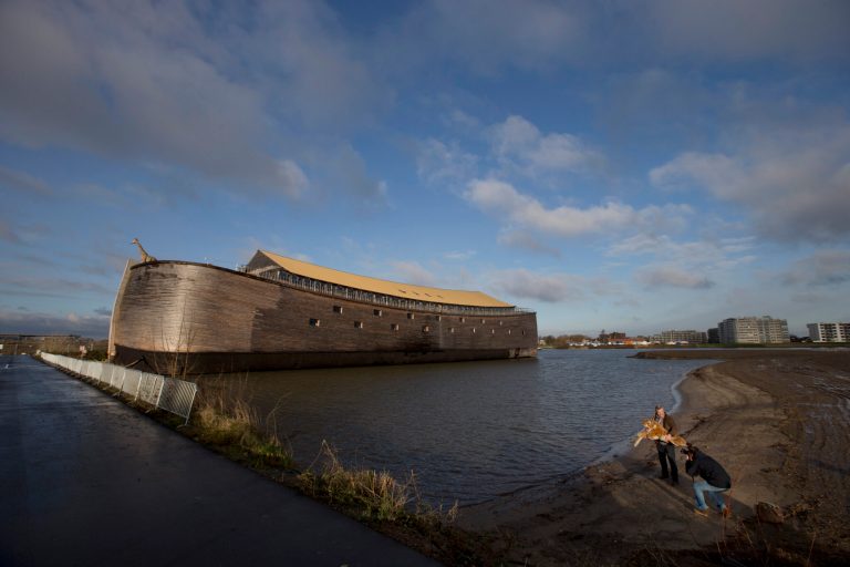   Johan Huibers, bottom right, poses, after being asked by a photographer to go outside, with a stuffed tiger in front of the full scale replica of Noahâs Ark in Dordrecht, Netherlands, Monday Dec. 10, 2012. The Ark has opened its doors in the Netherlands after receiving permission to receive up to 3,000 visitors per day. For those who donât know or remember the Biblical story, God ordered Noah to build a boat massive enough to save animals and humanity while God destroyed the rest of the earth in an enormous flood. (AP Photo/Peter Dejong)  