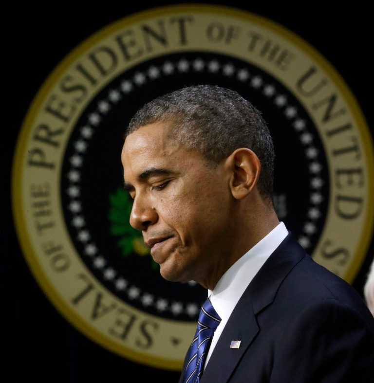 In a Thursday blog post, J. David Ake, AP's Washington assistant bureau chief for photography, tried to end the controversy by saying the halo effect is caused by the presidential seal behind the president. (AP Photo)Â 