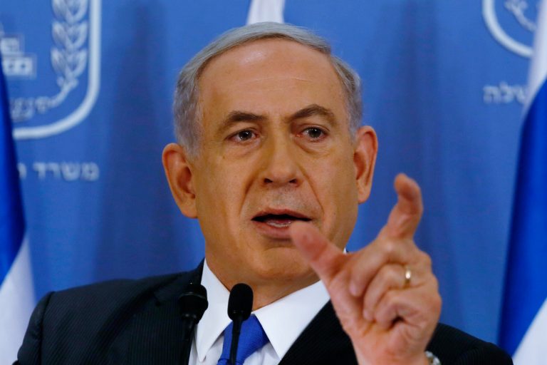 Israeli Prime Minister Benjamin Netanyahu gestures as he speaks during a press conference at the defense ministry in the Israeli coastal city of Tel Aviv on Friday, July 11, 2014. Netanyahu said he will not cave in to international pressure to stop a military offensive in the Gaza Strip. He told a news conference Friday that Israel will continue its offensive until rocket fire out of Gaza is halted. (AP photo/Gali Tibbon, Pool)