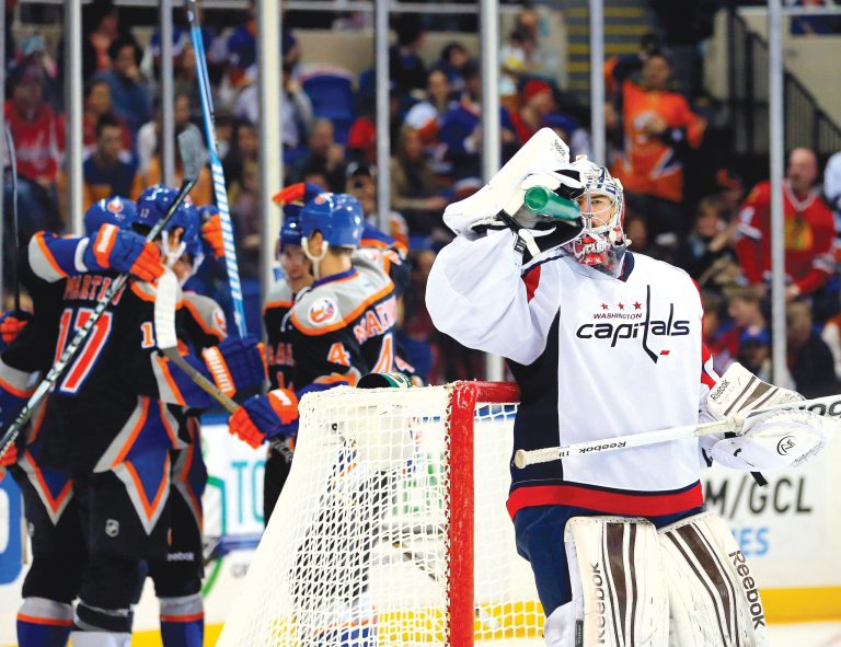 Paul J. Bereswill/AP
Capitals goalie Philipp Grubauer was pelted in his first NHL start, allowing five goals on 45 shots in a loss to the Islanders.