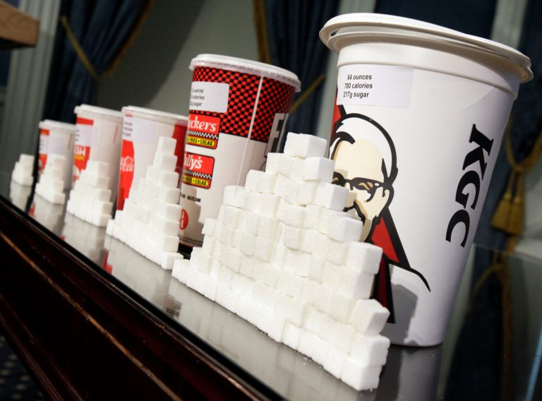 FILE - This May 31, 2012 file photo shows a display of various size cups and sugar cubes at a news conference at New York's City Hall. A judge struck down New York City's groundbreaking limit on the size of sugar-laden drinks Monday, March 11, 2013 shortly before it was set to take effect, agreeing with the beverage industry and other opponents that the rule is arbitrary in applying to only some sweet beverages and some places that sell them. (AP Photo/Richard Drew, File)