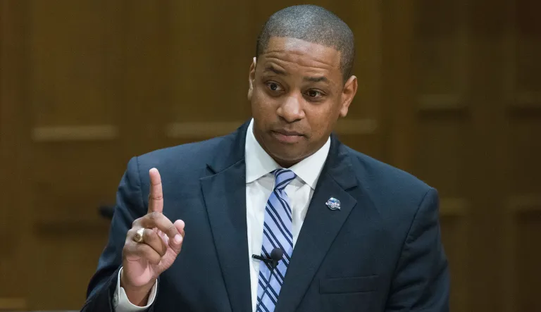 A picture of Justin Fairfax, the Democratic candidate for Virginia lieutenant governor, was removed from campaign fliers at the request of a labor union that opposes his candidacy but supports his running mate Ralph Northam, who's running for governor. (AP Photo/Steve Helber)